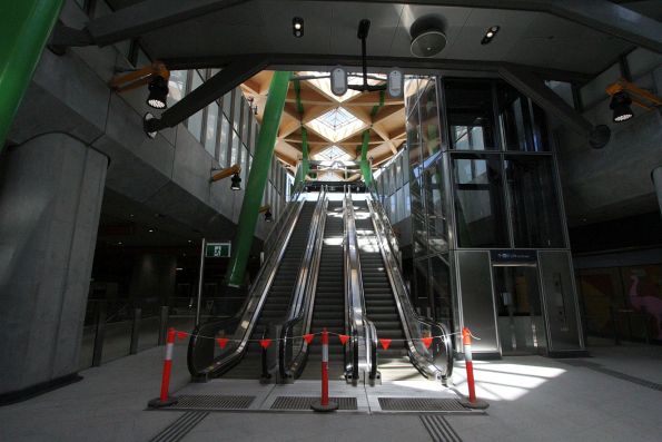 Trio of escalators and lift at the southern tram stop entrance to Anzac station