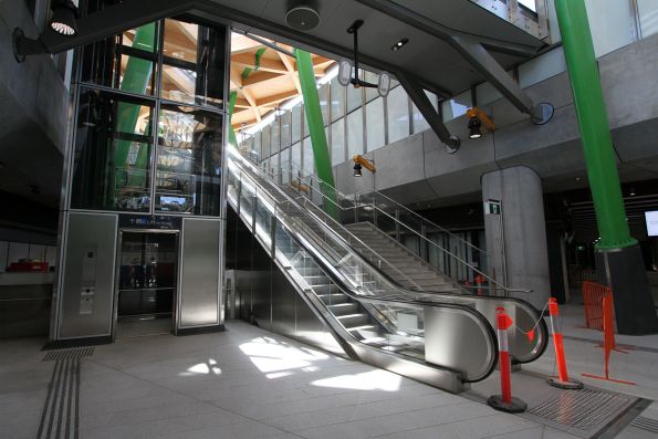 Single escalator, steps and lift at the northern tram stop entrance to Anzac station