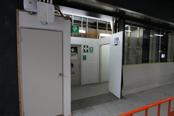 Temporary staff toilets built into a future retail space on the concourse at Anzac station