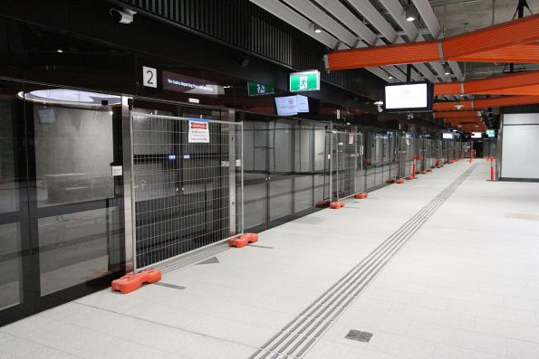 Temporary fencing in place across the platform screen doors at Anzac station