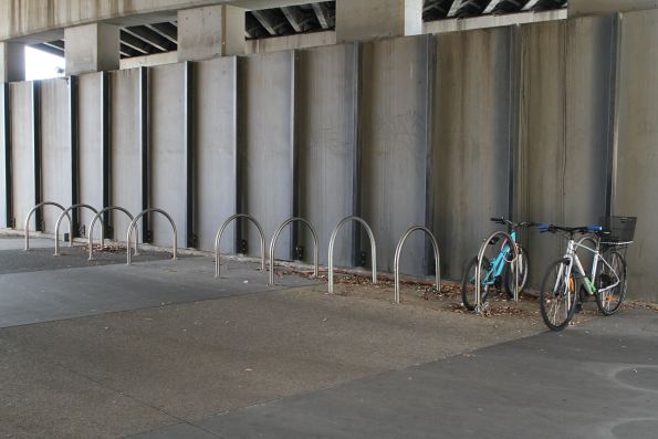 Mismatched bike hoops at Sunshine station after someone unbolted them to steal the bikes locked onto them